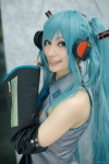 aqua_hair blouse cosplay detached_sleeves hatsune_miku headset mitsubachi_marie tie twintails vocaloid rating:Safe score:1 user:nil!