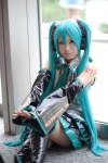 aqua_hair blouse cosplay default_costume detached_sleeves hatsune_miku headset pleated_skirt skirt thighhighs tie twintails uri vocaloid zettai_ryouiki rating:Safe score:3 user:nil!