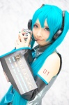 aqua_hair blouse cosplay detached_sleeves hatsune_miku headset mineo_kana tie twintails vocaloid rating:Safe score:0 user:pixymisa