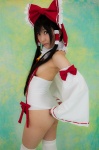 ass cosplay detached_sleeves hairbow hakurei_reimu kneepads lenfried miko one-piece_swimsuit swimsuit thighhighs touhou rating:Safe score:0 user:nil!