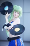 beatmania_iidx cosplay croptop erika_(beatmania) green_hair hair_clip leggings miniskirt shirayuki_himeno skirt tubetop rating:Safe score:0 user:pixymisa