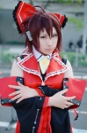 blouse cosplay detached_sleeves hairbow hakurei_reimu jacket nishiki red_hair touhou vest rating:Safe score:0 user:nil!