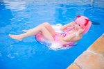bikini_top cosplay hair_ribbons inner_tube kaname_madoka mashiro_yuki miniskirt pink_hair pool puella_magi_madoka_magica skirt swimsuit twintails wet rating:Safe score:1 user:nil!