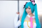 aqua_hair cheerleader_uniform collar cosplay detached_sleeves hair_ribbons hatsune_miku mogu sing_and_smile_(vocaloid) tie tubetop twintails vocaloid rating:Safe score:1 user:pixymisa