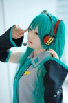 aqua_hair beng cosplay default_costume detached_sleeves hatsune_miku headset tie twintails vocaloid rating:Safe score:0 user:nil!