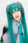 aqua_hair beng cosplay default_costume detached_sleeves hatsune_miku headset pleated_skirt skirt tie twintails vocaloid rating:Safe score:2 user:pixymisa