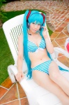 aqua_hair bikini cleavage cosplay hatsune_miku headset mashiro_yuki pool project_diva swimsuit twintails vocaloid rating:Safe score:1 user:nil!