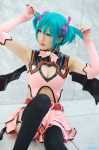 aqua_hair chii cleavage cosplay dress elbow_gloves fingerless_gloves garter_belt gloves hairbows hatsune_miku project_diva stirrup_socks tail twintails vocaloid wings world_is_mine_(vocaloid) rating:Safe score:3 user:nil!