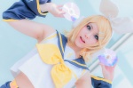 blonde_hair cosplay detached_sleeves hairbow hair_clips headphones honma kagamine_rin sailor_uniform scarf school_uniform shorts vocaloid rating:Safe score:2 user:pixymisa