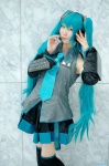 aqua_hair blouse cosplay detached_sleeves hatsune_miku headset kei pleated_skirt skirt thighhighs tie twintails vocaloid zettai_ryouiki rating:Safe score:0 user:nil!