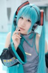 aqua_hair cosplay default_costume detached_sleeves hatsune_miku headset pool saki twintails vocaloid rating:Safe score:0 user:nil!