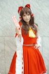 aizawa_kaneko blouse cosplay detached_sleeves hairbow hakurei_reimu miko skirt touhou rating:Safe score:2 user:nil!