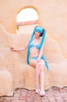 aqua_hair bikini cleavage cosplay hatsune_miku headset mashiro_yuki project_diva swimsuit twintails vocaloid rating:Safe score:0 user:nil!