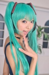 aqua_hair cosplay hatsune_miku headset necoco necosmo one-piece_swimsuit swimsuit twintails vocaloid rating:Safe score:1 user:nil!