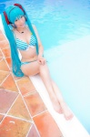 aqua_hair bikini cleavage cosplay hatsune_miku headset mashiro_yuki pool project_diva swimsuit twintails vocaloid wet rating:Safe score:1 user:nil!