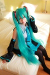 aqua_hair arai_yomi bed blouse cosplay detached_sleeves hatsune_miku headset pleated_skirt skirt thighhighs tie twintails vocaloid rating:Safe score:0 user:nil!