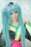 aqua_hair blue_eyes bow cosplay dress hatsune_miku mizusa twintails vocaloid rating:Safe score:1 user:pixymisa