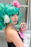bow cosplay detached_sleeves dress ear_muffs flower green_eyes green_hair hatsune_miku microphone twintails vocaloid yunami rating:Safe score:0 user:pixymisa