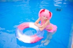 bikini_top cosplay hair_ribbons inner_tube kaname_madoka mashiro_yuki miniskirt pink_hair pool puella_magi_madoka_magica skirt swimsuit twintails wet rating:Safe score:0 user:nil!
