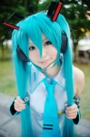 aice aqua_hair cosplay default_costume detached_sleeves hatsune_miku headset tie twintails vocaloid rating:Safe score:1 user:nil!